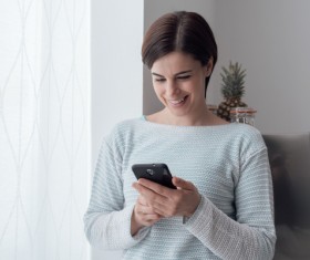 Woman using smart phone Stock Photo