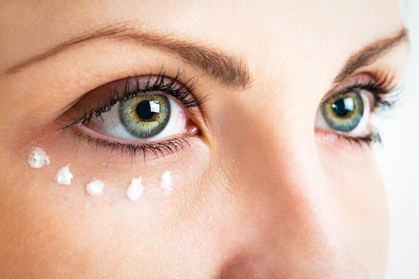 Woman wiping eye gel Stock Photo