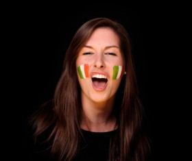 Woman with Italian flag painted on his face Stock Photo