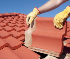 Worker repairing the roof Stock Photo 03