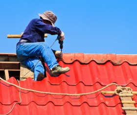 Worker repairing the roof Stock Photo 05