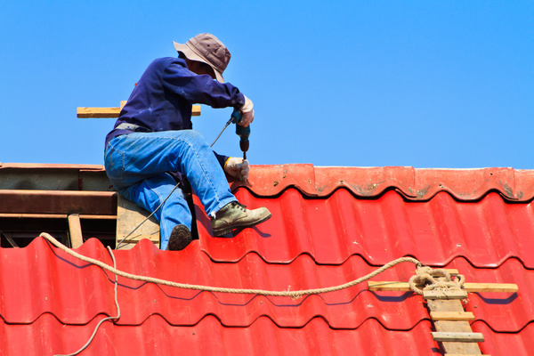 Worker repairing the roof Stock Photo 05