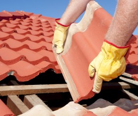 Worker repairing the roof Stock Photo 09