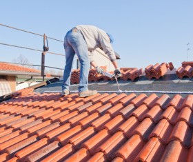 Worker repairing the roof Stock Photo 11