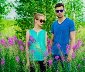 Young couple posing in flowers Stock Photo 02