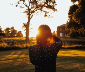 Young girl posing under sunlight Stock Photo