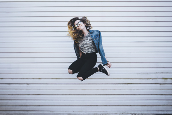 Young girl posing with jumping style Stock Photo