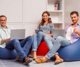Young man relaxing in an inflatable chair Stock Photo