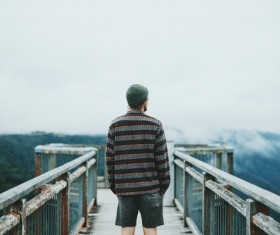 Young man watching mountain landscape Stock Photo