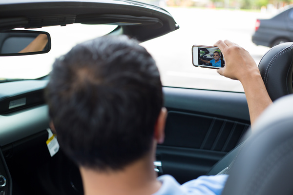 man who uses smartphone to take pictures Stock Photo