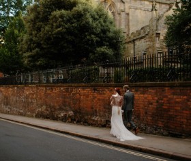 marriage couple walking on pavement Stock Photo