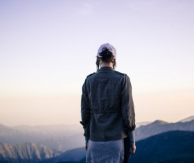 woman standing on high mountain Stock Photo