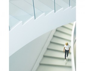 woman walking on staircase Stock Photo