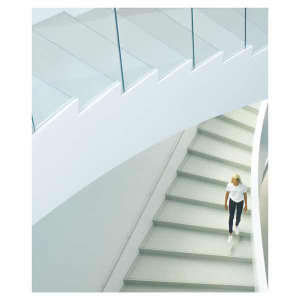 woman walking on staircase Stock Photo