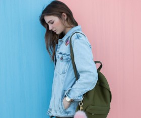 young girl posing in casual jean coat Stock Photo