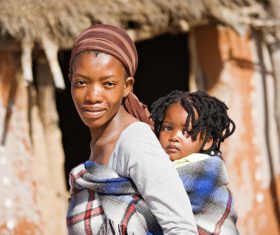 African mother On the back baby Stock Photo 01