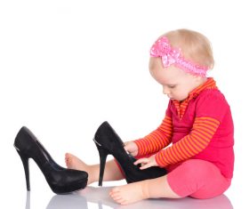 Baby playing with high heels Stock Photo 01