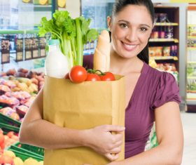 Beautiful housewife buying food in supermarket Stock Photo 02