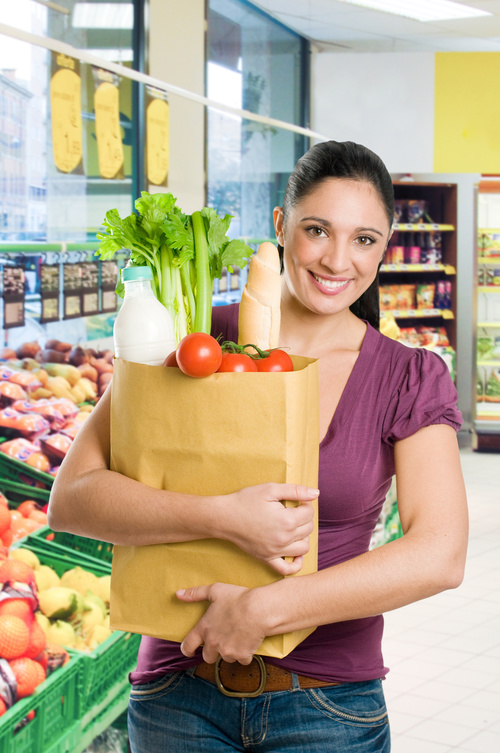 Beautiful housewife buying food in supermarket Stock Photo 02