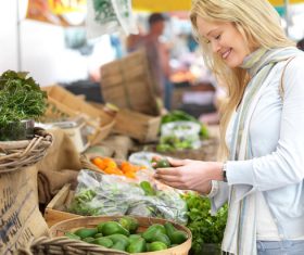 Beautiful housewife buying food in supermarket Stock Photo 03