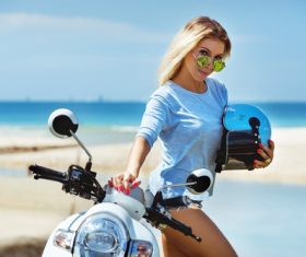 Beautiful woman and scooter Stock Photo