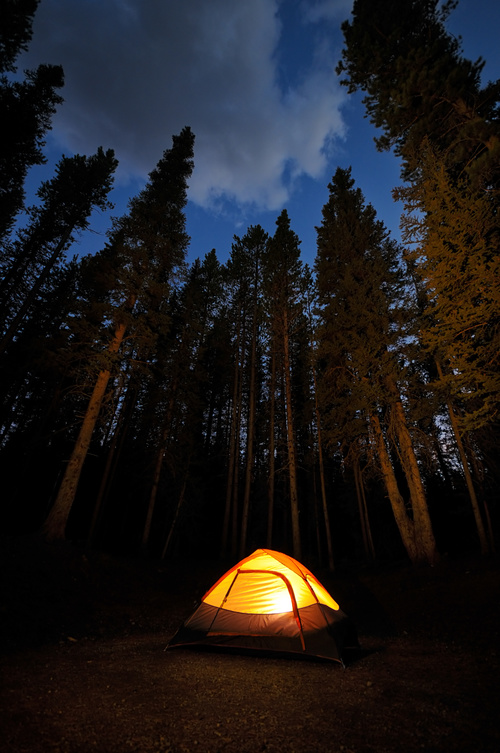 Bright camping tent at night Stock Photo