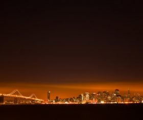 Brightly lit city and bridge Stock Photo 04