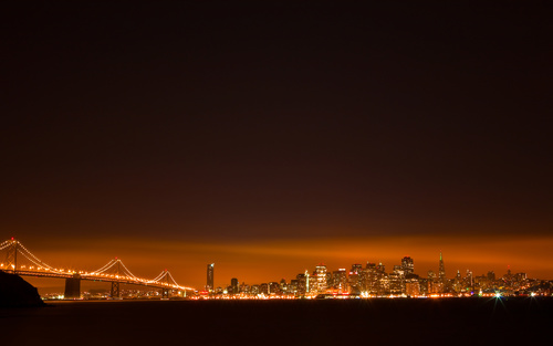Brightly lit city and bridge Stock Photo 04