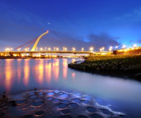 Brightly lit city and bridge Stock Photo 05