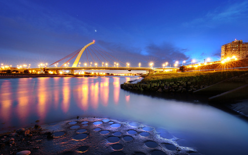 Brightly lit city and bridge Stock Photo 05