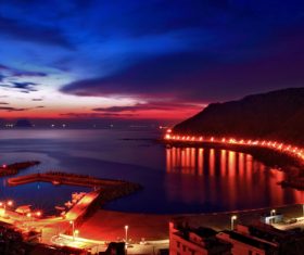 Brightly lit seaside road Stock Photo