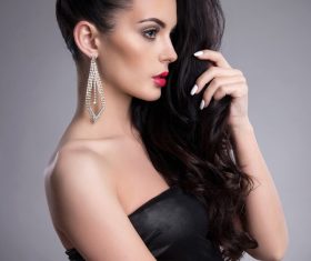 Brunette girl wearing earrings Stock Photo 05