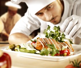 Chef decorating dishes Stock Photo