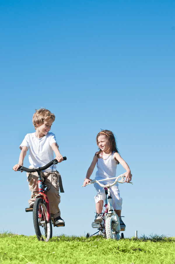 Children riding bicycles Stock Photo 01