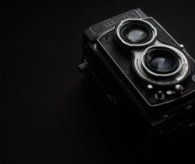 Closeup vintage camera in darkness Stock Photo