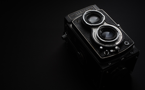 Closeup vintage camera in darkness Stock Photo