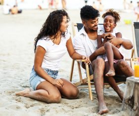 Coaxing daughters happy parents Stock Photo