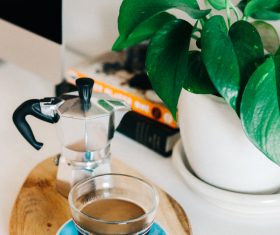 Coffee and green plants on the table Stock Photo