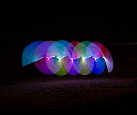 Colorful lights circles in darkness Stock Photo