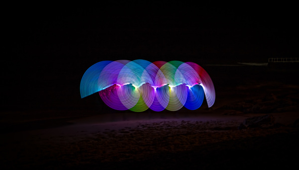 Colorful lights circles in darkness Stock Photo