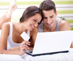 Couple shopping online together Stock Photo