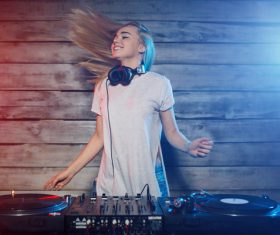 DJ girl swings with music Stock Photo 01