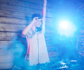 DJ girl swings with music Stock Photo 03