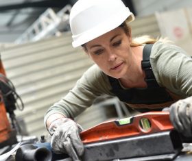 Female worker using balancer Stock Photo