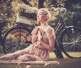 Girl with a bicycle resting in the bosom of nature Stock Photo (2)