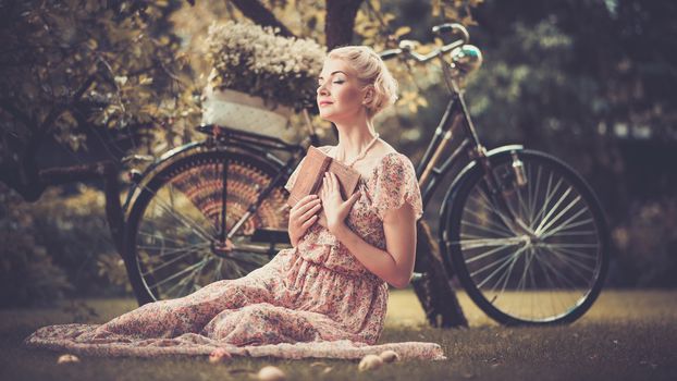 Girl with a bicycle resting in the bosom of nature Stock Photo (2)