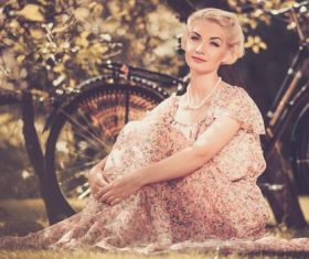 Girl with a bicycle resting in the bosom of nature Stock Photo (4)
