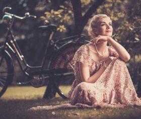 Girl with a bicycle resting in the bosom of nature Stock Photo (5)