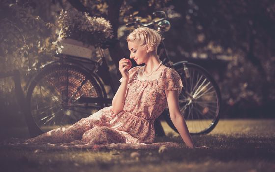 Girl with a bicycle resting in the bosom of nature Stock Photo (6)