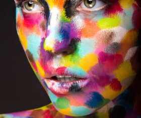 Girl with colored face painted Stock Photo 04